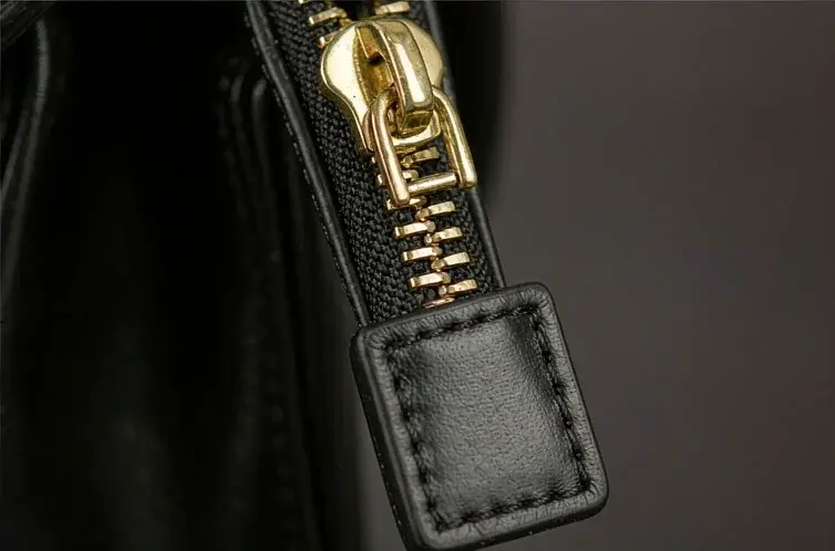 OEM handbag hardware set with branded zip puller, cast plate and magnetic closure in matched plating